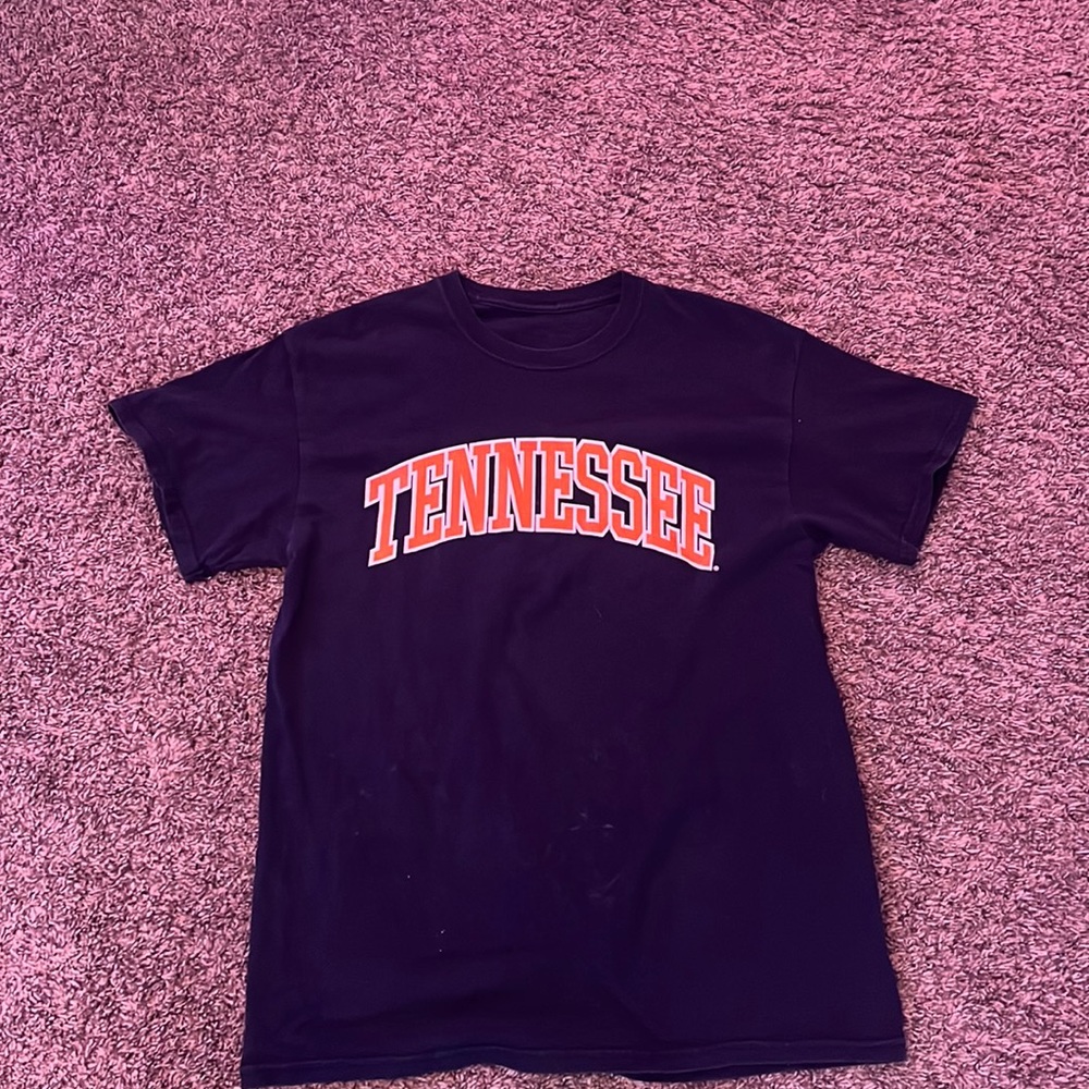 orange letters that spell tennessee and navy blue on out side.